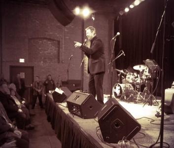 Vintage concert performance with audience